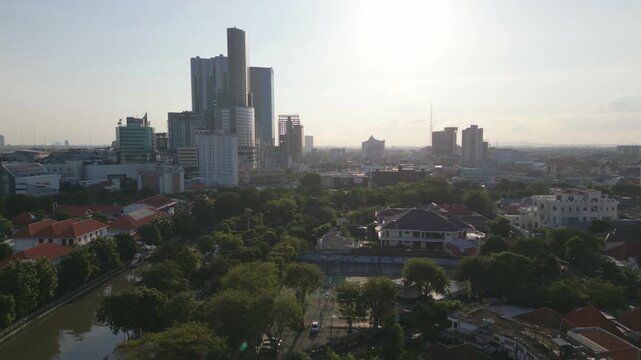 Surabaya river and Tunjungan Plaza skyline aerial panorama before sunset