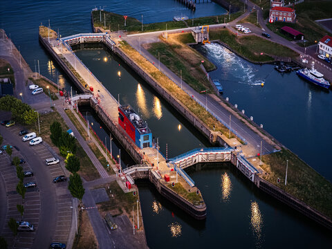 Aerial view of Sluizen Van Vlissingen showing the lock gates, water channels, and surrounding infrastructure at twilight in Vlissingen, Zeeland, Netherlands.