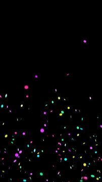 Multicolor confetti explosion falling down. Festive party celebration background.