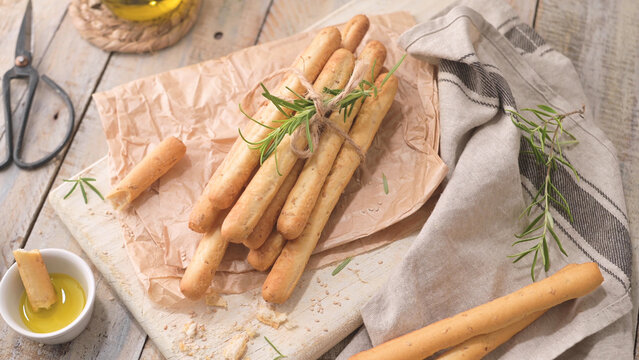 Bundle of Fresh Baked Rosemary Breadsticks with Olive Oil