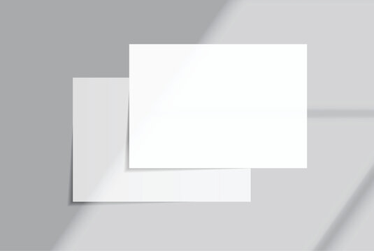 Blank white A4 paper sheets mockup on background with elegant organic shadow overlay. Perfect for displaying stationery designs, flyers, posters, branding, Ads and print design presentations