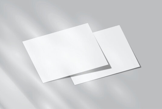 Blank white A4 paper sheets mockup on background with elegant organic shadow overlay. Perfect for displaying stationery designs, flyers, posters, branding, Ads and print design presentations