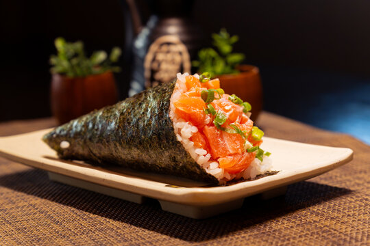 Fresh Salmon Temaki with Cream Cheese and Green Onion in Japanese Restaurant