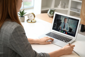Young woman having job interview online at home, closeup