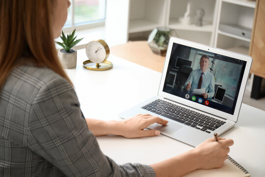 Young woman having job interview online at home, closeup