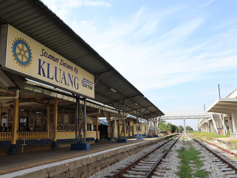 Kluang , Johor, Malaysia - 16 July 2025 : Low-Angle Eye-Level Horizontal View of Kluang Railway Station Platform and Tracks under Blue Sky
Captured at the historic Kluang Railway Station in Johor