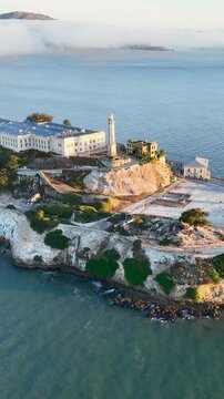 Alcatraz Island At San Francisco California United States. Lighthouse Standing Tall On Beach With Ocean Waves Crashing. Construction Landscape Buildings Awesome. Buildings. San Francisco California.