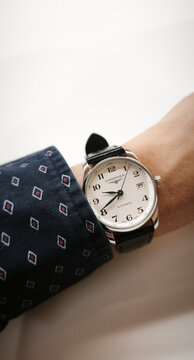 BANGKOK, THAILAND - JUNE 27 : Longines Master Collection, numeric marker, white dial in stainless steel case with alligator strap wear on wrist in Bangkok, Thailand, on June 27, 2026.