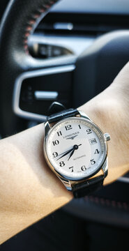 BANGKOK, THAILAND - JUNE 27 : Longines Master Collection, numeric marker, white dial in stainless steel case with alligator strap wear on wrist in Bangkok, Thailand, on June 27, 2026.