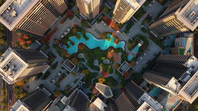 Drone view of residential buildings in China with swimming pool and garden in autumn