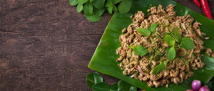Spicy minced meat salad or Laap on a banana leaf