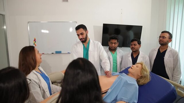 Medical students learning obstetrics with a birthing simulator mannequin