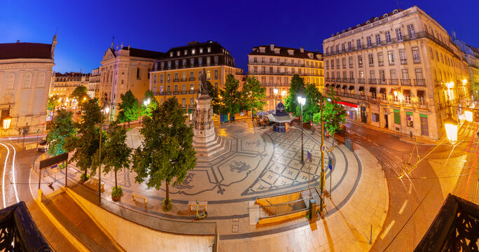 Panoramic view of Luis de Camoes Square illuminated at blue hour in Lisbon, Portugal.