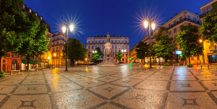 Panoramic view of Luis de Camoes Square illuminated at blue hour in Lisbon, Portugal.