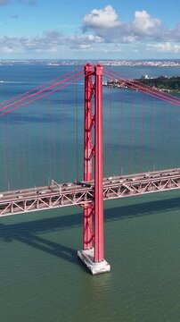 25 Of April Bridge At Lisbon In Lisbon District Portugal. Downtown City Skyline. Transportation Scenery. 25 Of April Bridge At Lisbon In Lisbon District Portugal. Famous Cable Stayed Bridge.