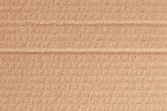 Brown cardboard sheet abstract background, texture of recycle paper box in old vintage pattern for design art work.