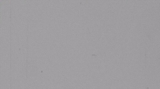 Vintage film scratches and grain gray texture overlay with dust particles, linear scratches, noise effects