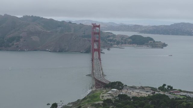 Legendary Golden Gate Bridge - Aerial Pullback Marin Headlands Coastal Road Overcast