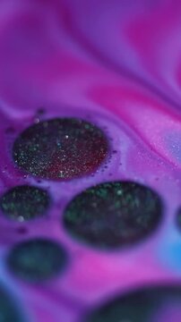 Vertical video. Ink stains. Oil droplet. Defocused pink blue colorful sparkling water marble wet round liquid on abstract art chemical background.