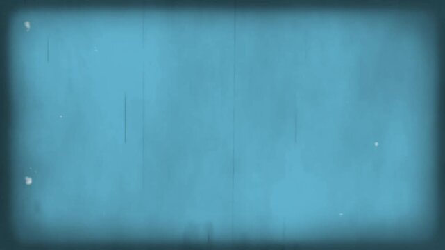 Film grain texture overlays a solid blue surface creating a vintage aesthetic for creative projects.