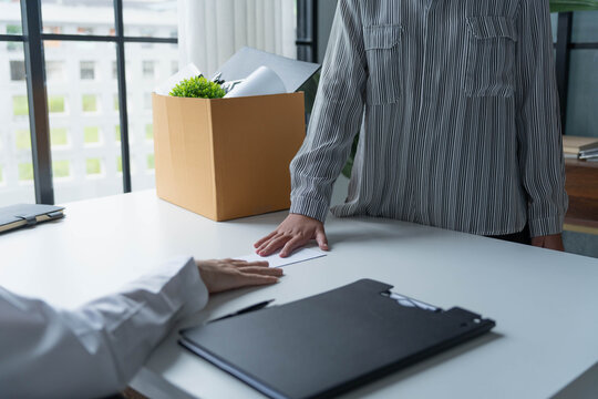 Asian office worker informs HR of resignation