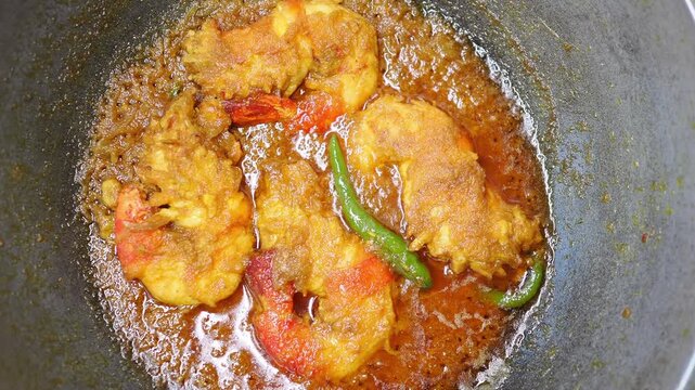 Cooking shrimp in hot oil on the stovetop