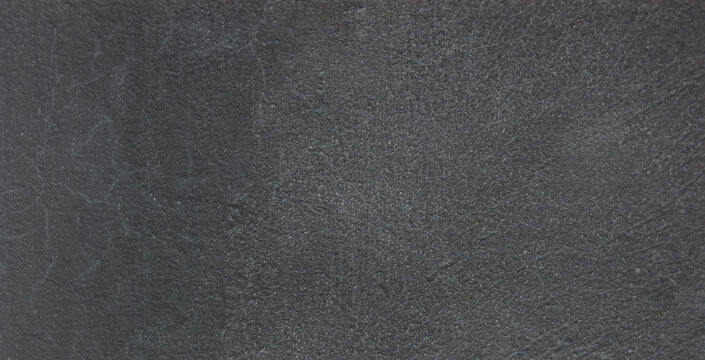 Dark charcoal slate texture background, natural black stone surface with fine grain, matte mineral rock finish for architectural design