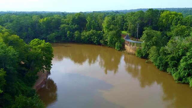 Aerial drone fly over a river in the forest in the deep south Georgia USA