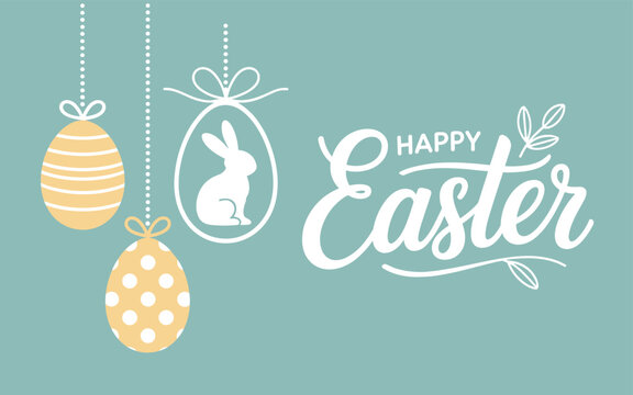 Easter eggs and bunny hang from strings on Happy Easter sign