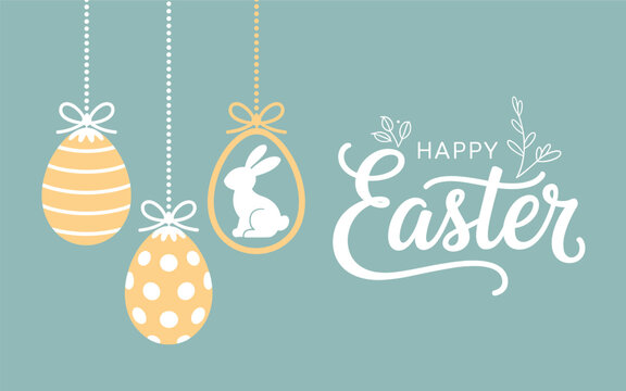 Easter eggs hang from strings with a bunny beside Happy Easter text