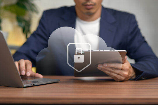 Business Professional Using Digital Tablet and Laptop at Office Desk