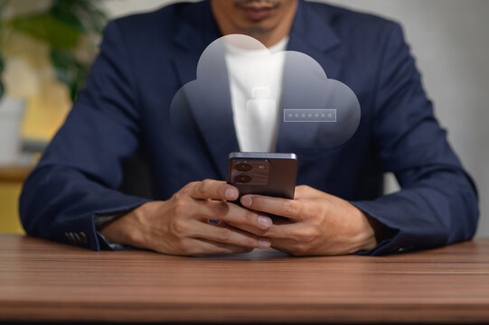 Businessman Using Smartphone with Cloud Technology Concept in Office