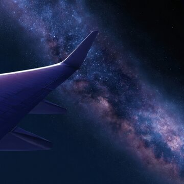 Airplane wing against a starry night sky