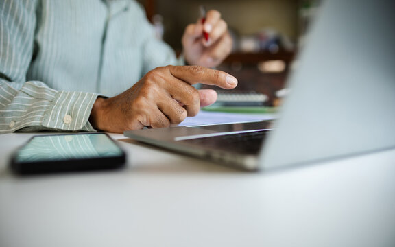 close-up shot, man hand working with laptop start online business, E-commerce. work at home meeting and discussion via laptop computer