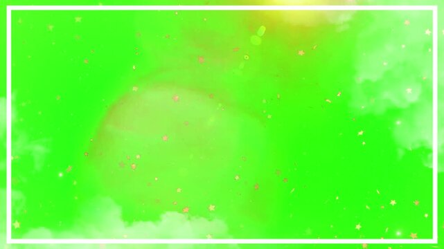 Frame border overlays a vibrant green screen background featuring soft clouds and glowing light particles for professional video editing.
