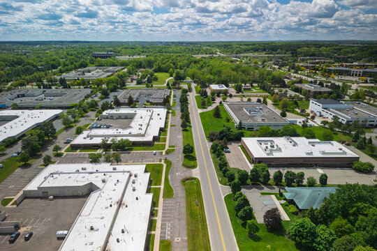 Business park aerial view showing automotive supplier office buildings and green landscape in Michigan