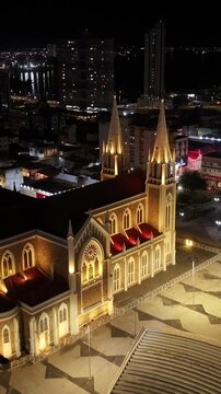 Night Sagrado Coracao De Jesus Cathedral At Petrolina In Pernambuco Brazil. Dom Malan Square. Downtown City. Illuminated Church. Sagrado Coracao De Jesus Cathedral In Petrolina. City At Night Skyline.