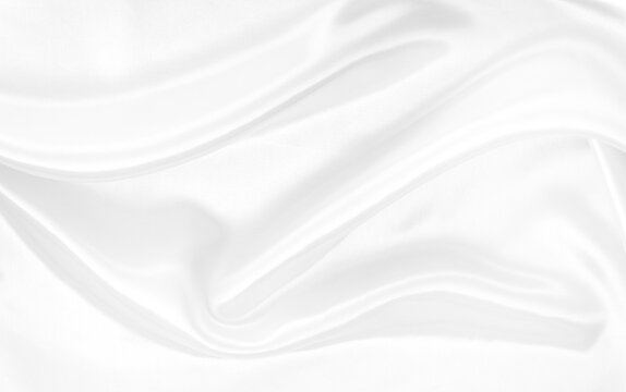 White gray satin texture that is white silver fabric silk background with beautiful soft blur pattern natural.