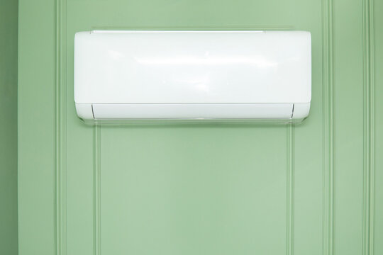 Air conditioner maintains cool indoor climate. Efficiency and comfort technology concept