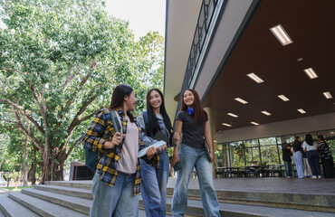 Obraz premium Group of diverse students walking together on campus
