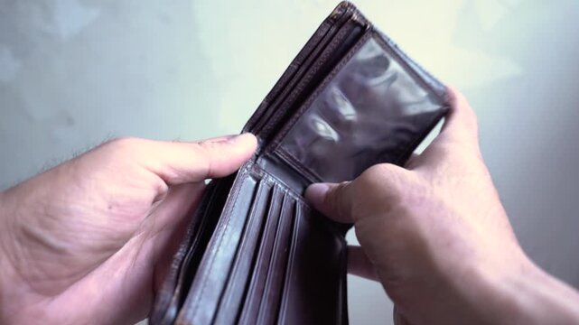 man opened empty wallet with no money
