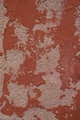Fototapeta premium Weathered wall surface with gray oncrete and orange paint background texture backdrop.