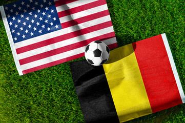 Fototapeta premium United States vs Belgium, national flags before international football match, football on green grass with stadium in the background, Lumen Field, Seattle, United States, July 6, 2026