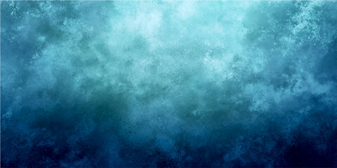 Fototapeta premium Textured grunge background with gradient of deep blue and light blue, abstract paint effect, artistic and moody atmospheric backdrop.