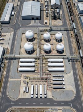 Aerial View of Industrial Chemical Storage Facility with Spherical and Horizontal Tanks.