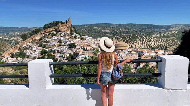 Woman Tourist with Hat Looking at Montefrio Village Viewpoint Granada Andalusia Spain Travel Back View