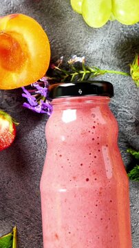 Fresh Strawberry Smoothie Bottle with Apricot Grape and Mint Flat Lay Healthy Drink Nutrition
