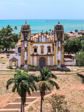 Historic baroque church with a palm tree in the colonial old town, Olinda, Pernambuco, Brazil
