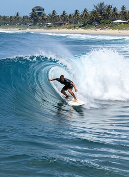 Captures Male Surfer In Midst Of Riding Wave Dressed Dark Colored Wetsuit Contrasts With Light Skin Tone Suggesting Belong To Caucasian