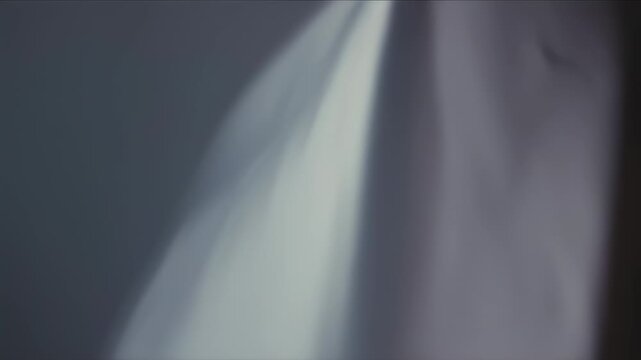 Gray and white abstract light shapes.